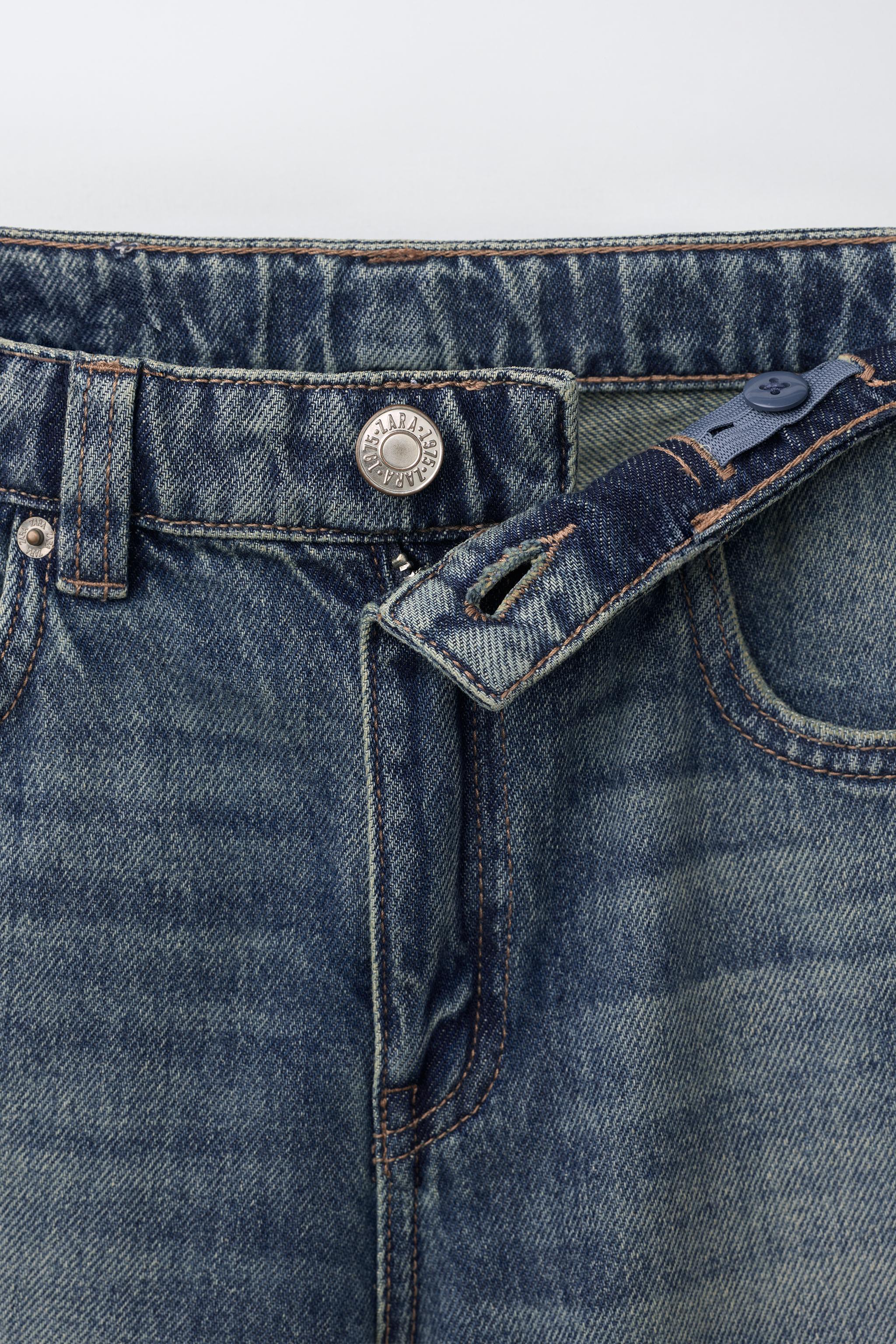 FLARE FIT FRAYED JEANS